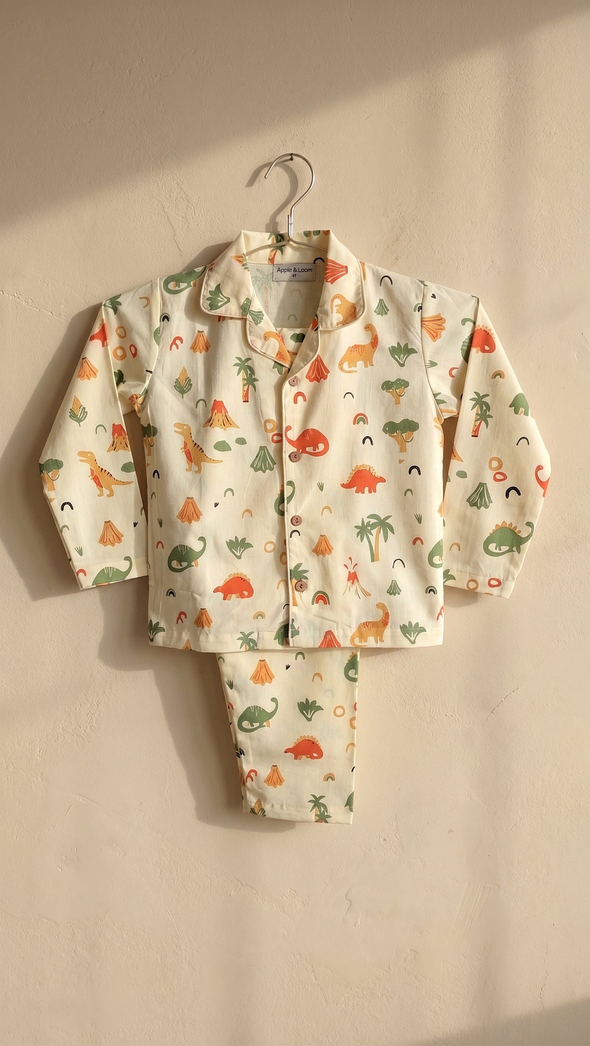 Dino print on butter yellow fabric