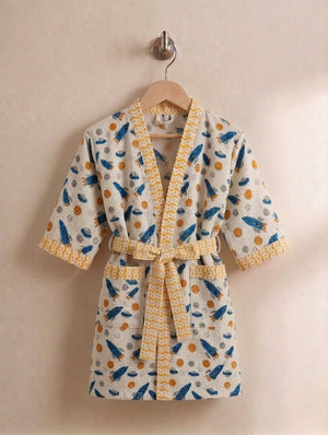 Kids cotton waffle lounger cover-up with hand printed rocket pattern front view